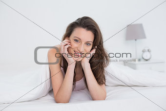 Close up portrait of a pretty woman resting in bed