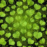 Dark seamless pattern with green leaves 