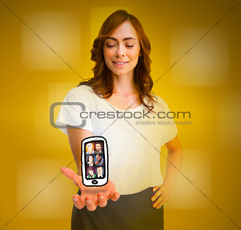 Cheerful woman levitating a mobile phone picture
