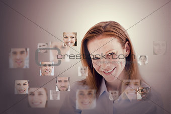 Smiling businesswoman encircled by digital interface
