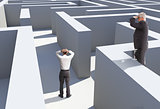 Two businessmen standing in maze