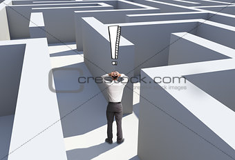 Rear view of desperate businessman standing in maze