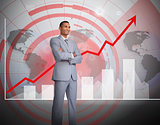 Attractive businessman standing in front of graphics