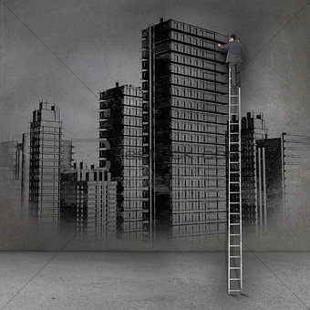 Picture of businessman standing on ladder in front of dark wall with city