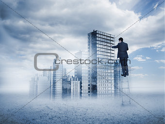 Rear view of businessman touching holographic city