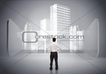Rear view of businessman looking at holographic city