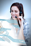 Smiling woman with headset using futuristic interface hologram