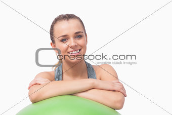 Young ponytailed woman smiling at camera