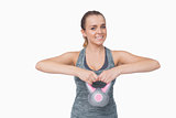 Attractive woman working with a kettle bell