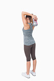 Rear view of woman working with kettle bell