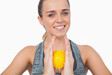 Happy woman holding massage ball between her hands