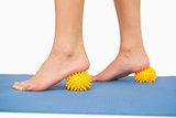 Close up of female feet touching massage ball