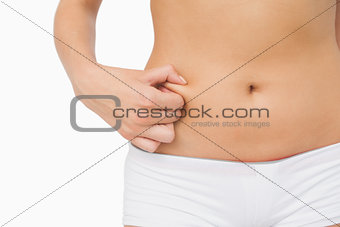 Slim woman with little fat on her belly