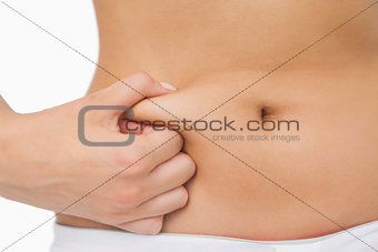 Young slim woman with little fat on her belly
