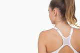 Rear view of ponytailed young woman wearing a sports bra