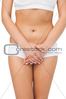 Young slim woman wearing a sports bra posing