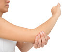 Woman touching her sore elbow