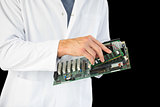 Close up of computer engineer holding hardware at night