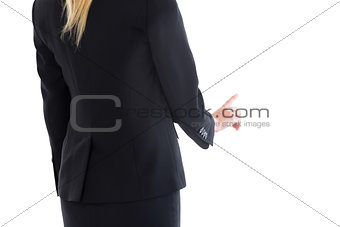 Mid section of blonde businesswoman pointing