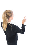 Attractive ponytailed business woman pointing