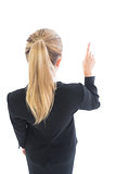 Ponytailed business woman pointing