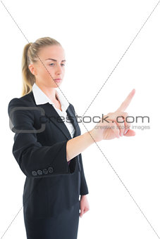 Side view of attractive young businesswoman pointing
