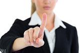 Close up of young businesswoman pointing upwards