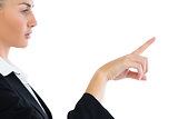 Profile view of attractive businesswoman pointing