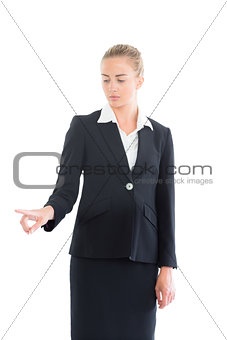 Young business woman pointing