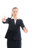 Attractive businesswoman pointing with her hands