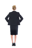 Rear view of young blonde businesswoman