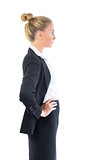 Cute businesswoman posing with hands on hips