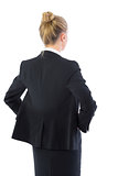 Rear view of posing young business woman