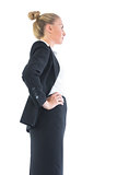 Low angle profile view of young businesswoman posing