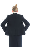 Low angle rear view of young businesswoman posing