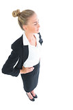 High angle side view of blonde young businesswoman posing