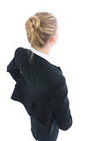 High angle rear view of attractive blonde businesswoman posing
