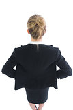 High angle rear view of blonde young businesswoman posing
