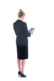 Blonde young businesswoman working with her tablet