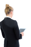 Young blonde businesswoman working with her tablet