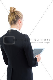 Young blonde businesswoman working with her tablet