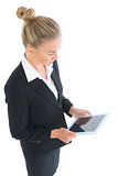Side view of cute businesswoman working with her tablet