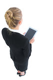 Attractive blonde businesswoman holding a tablet