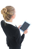 Young blonde cute businesswoman holding her tablet