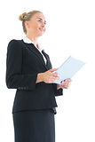 Low angle side view of blonde attractive businesswoman holding her tablet