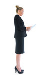 Side view of smart attractive businesswoman using her tablet