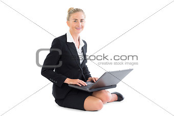 Side view of calm pretty businesswoman using her notebook