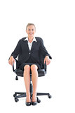 Content young businesswoman sitting on an office chair
