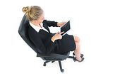 High angle view of cute businesswoman sitting on an office chair