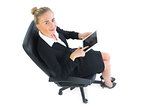 Portrait of blonde cute businesswoman sitting on an chair